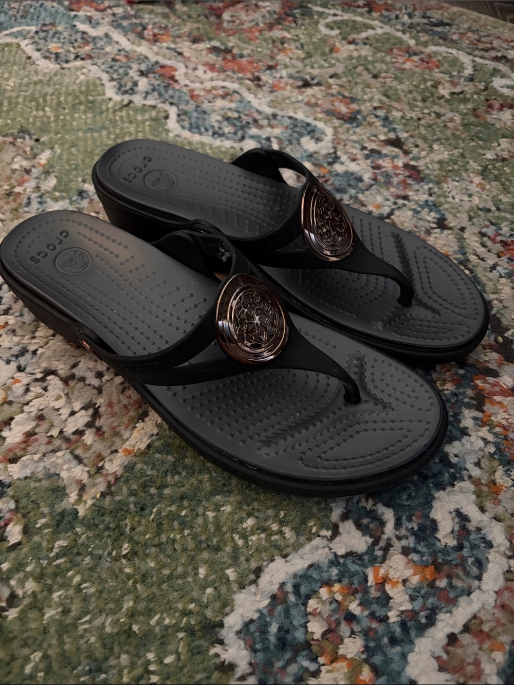 CROCS Women’s Black Flip Flop Sandals with Bronze Accent